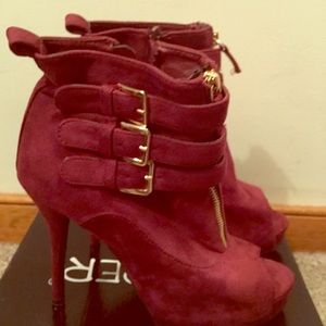 Burgundy booties with gold buckles